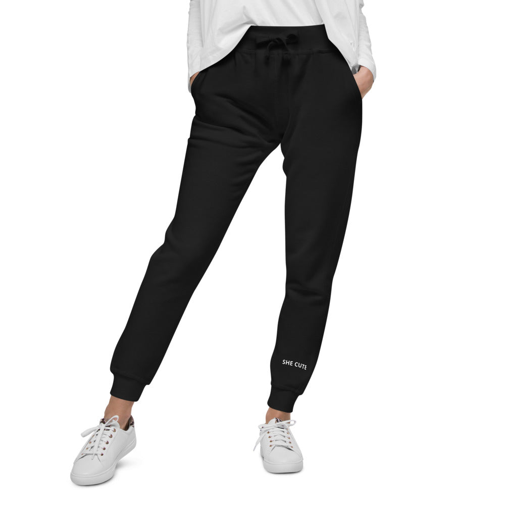 http://www.shecute.com.co/cdn/shop/products/unisex-fleece-sweatpants-black-front-60a74c2c6ad37_1200x1200.jpg?v=1621576753